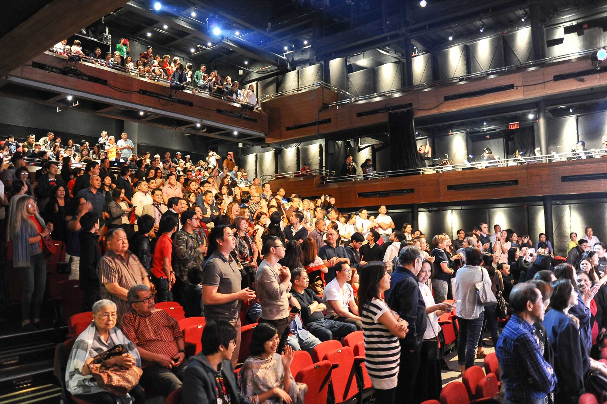 In Photo 4 Alumni and guests as they give the cast a standing ovation