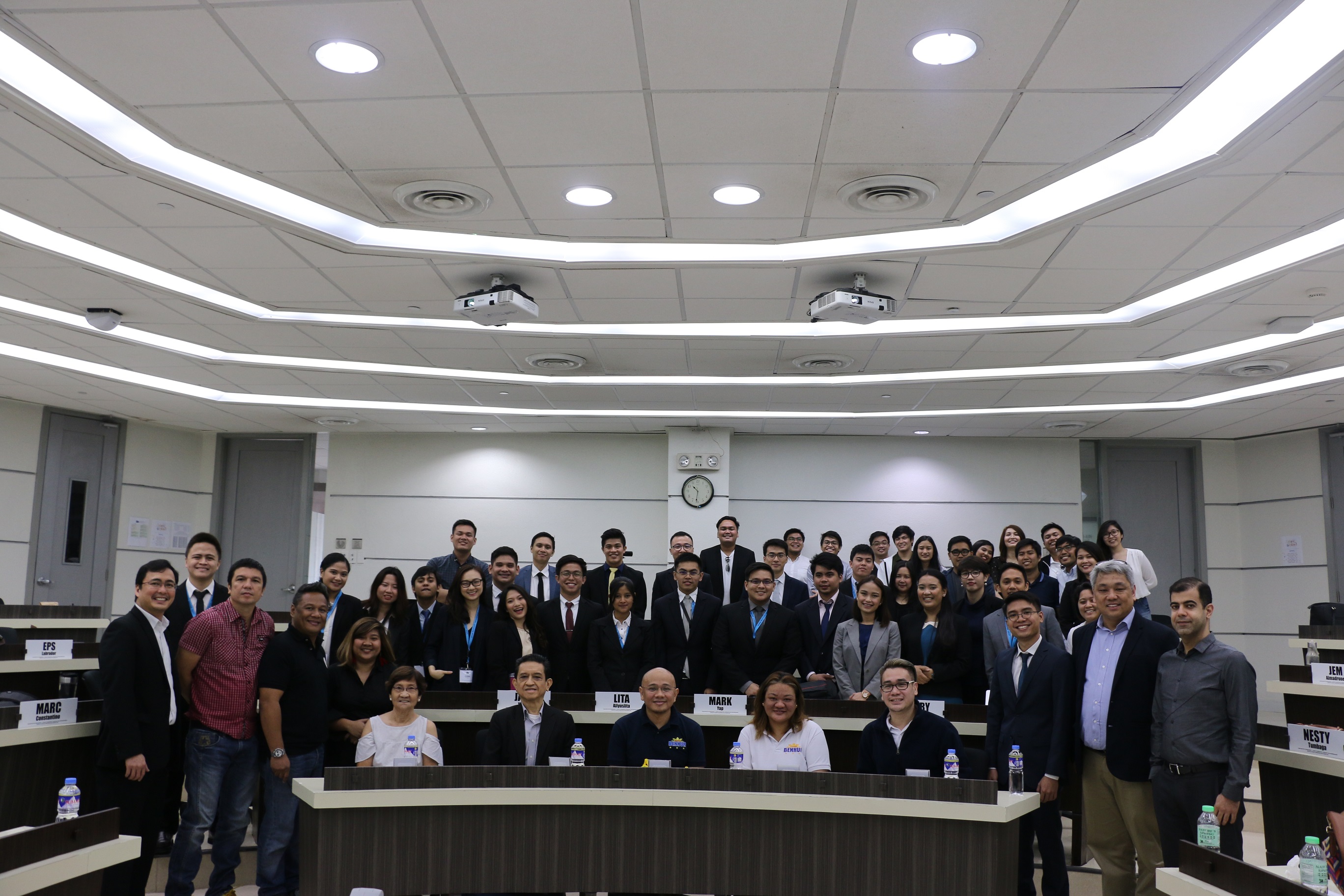 Professor Matthew Escobido (leftmost) with the students and professors of the Master of Science in Innovation and Business program and officials of Barangay Poblacion.