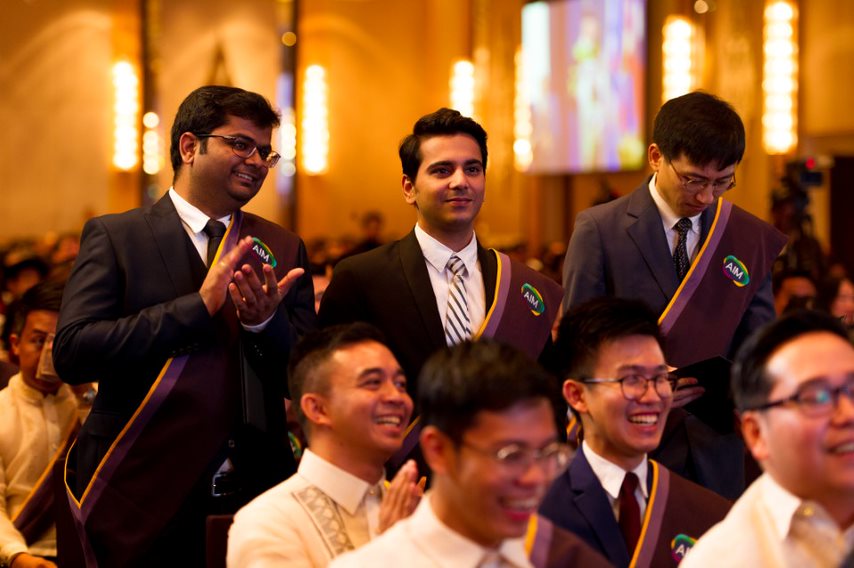 AIM graduates proudly applauding their fellow graduates’ messages 