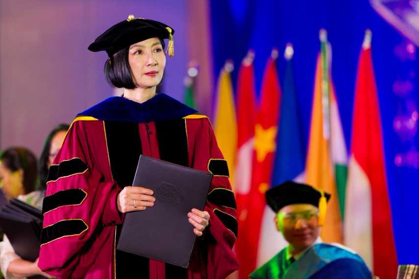 President and Dean of AIM, Jikyeong Kang, PhD, awarding diplomas to the graduates 