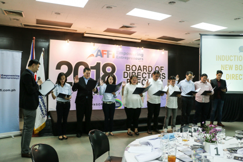 Outgoing AFFI President John Chung inducts the 2018 Board of Directors
