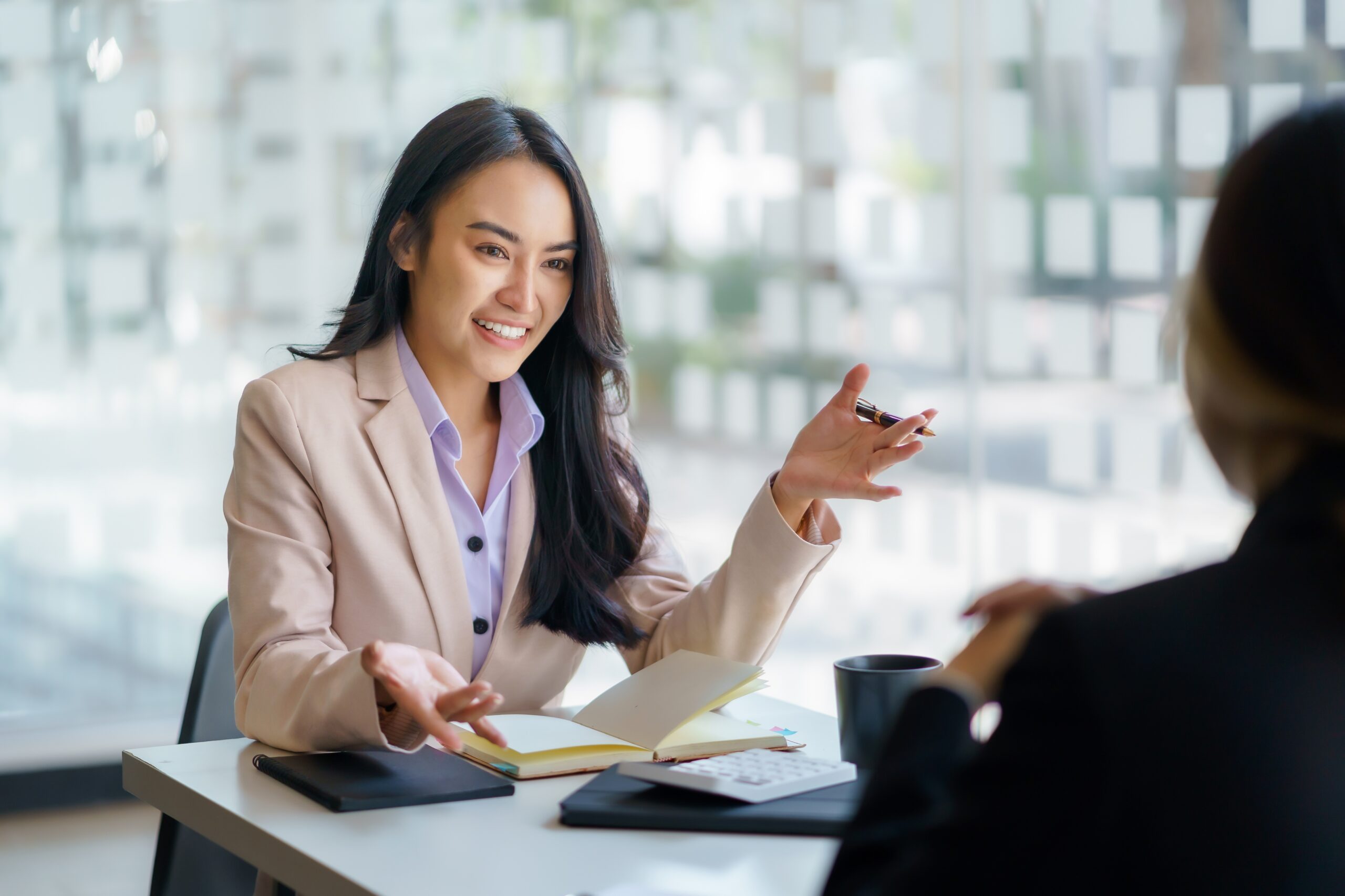 Two,Beautiful,Young,Asian,Businesswoman,In,The,Conversation,,Exchanging,Ideas