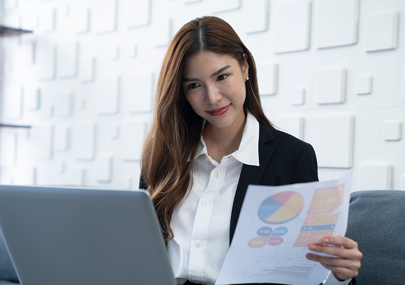 a data analyst holding a document