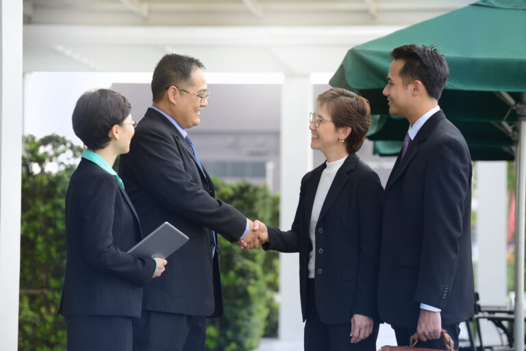 Business people shaking hands, finishing up a meeting