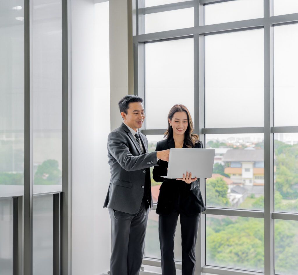 An,Asian,Business,Executive,Inspects,The,Work,Of,A,Female