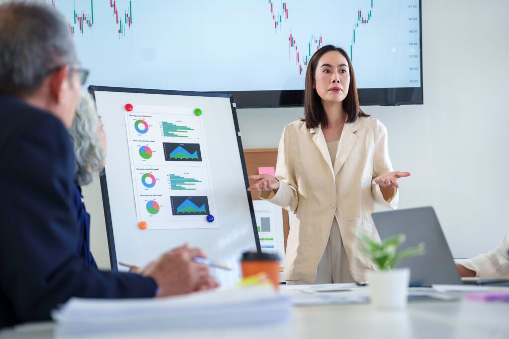 a senior data analyst presenting to clients