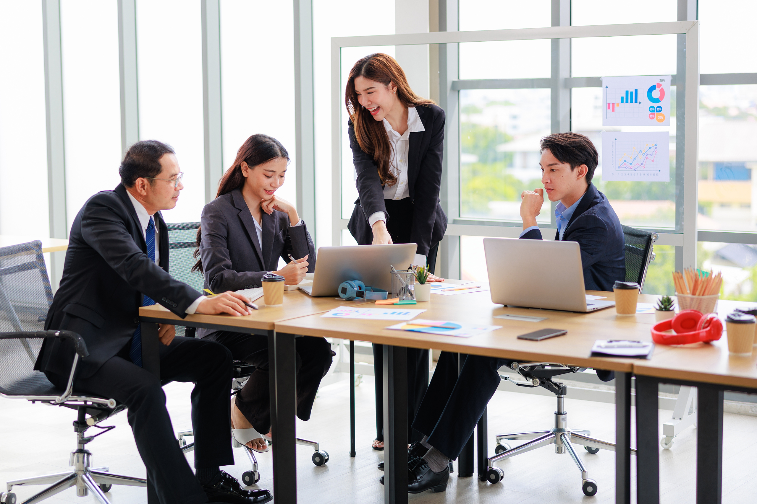 Professional,Asian,Colleagues,In,A,Contemporary,Office,Setting,,Strategizing,For
