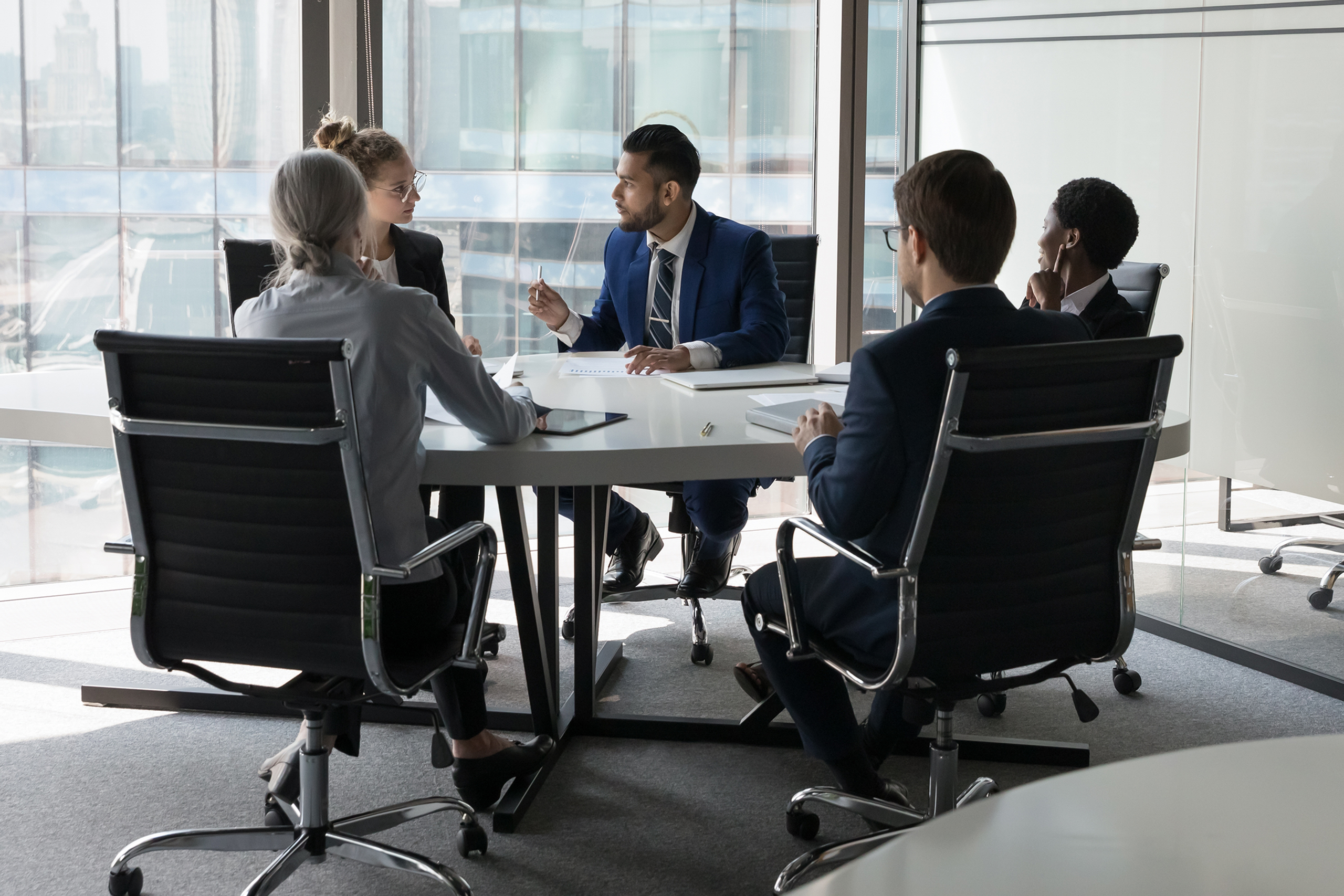 Serious,Team,Of,Professionals,,Five,Multi,Ethnic,Business,People,Negotiating