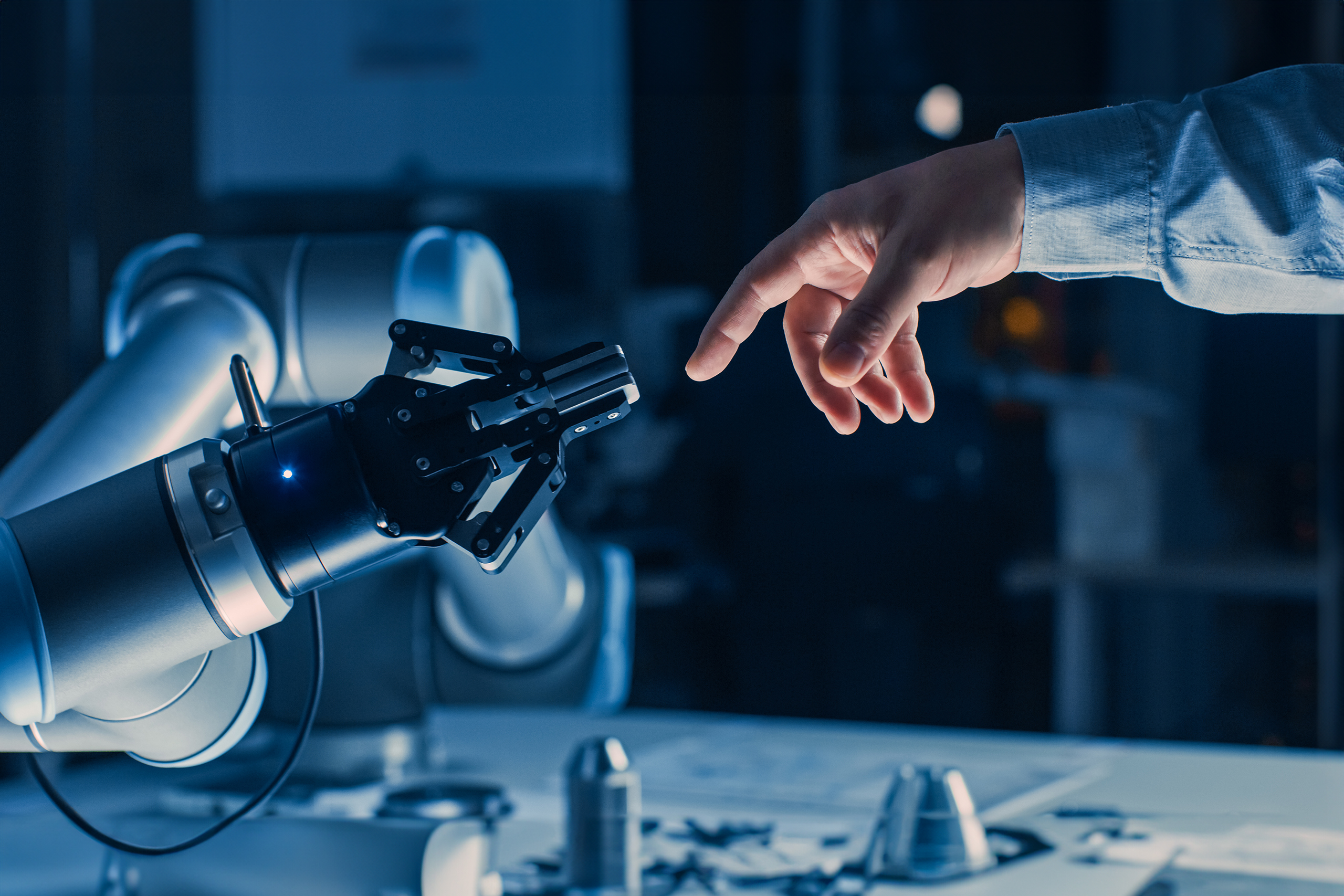Futuristic,Robot,Arm,Touches,Human,Hand,In,Humanity,And,Artificial
