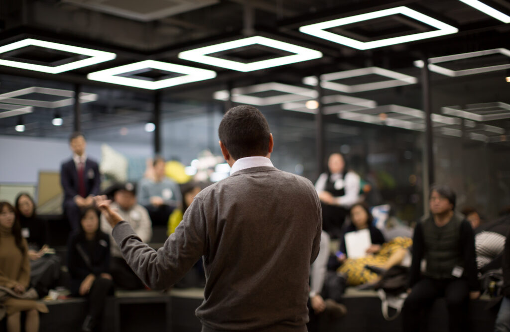 a business expert presenting to a group of people