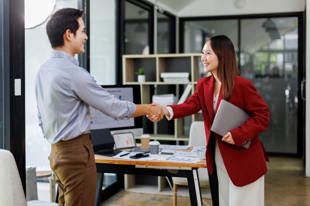 development management professionals shaking hands