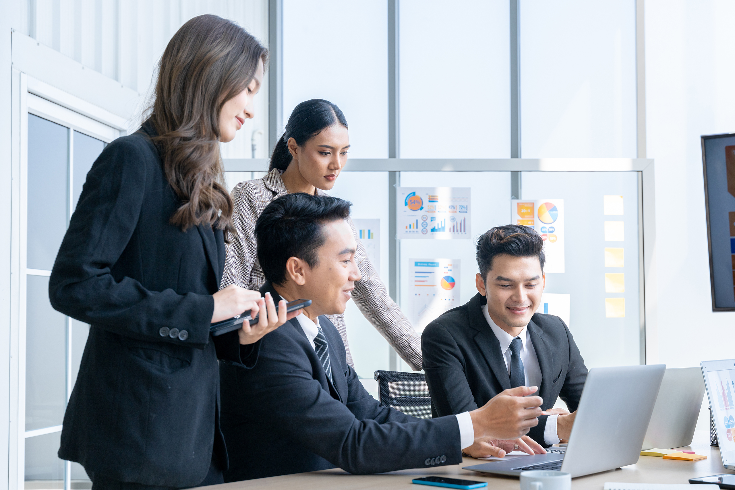A,Group,Of,Young,Asian,Businessmen,Talking,And,Planning,Work