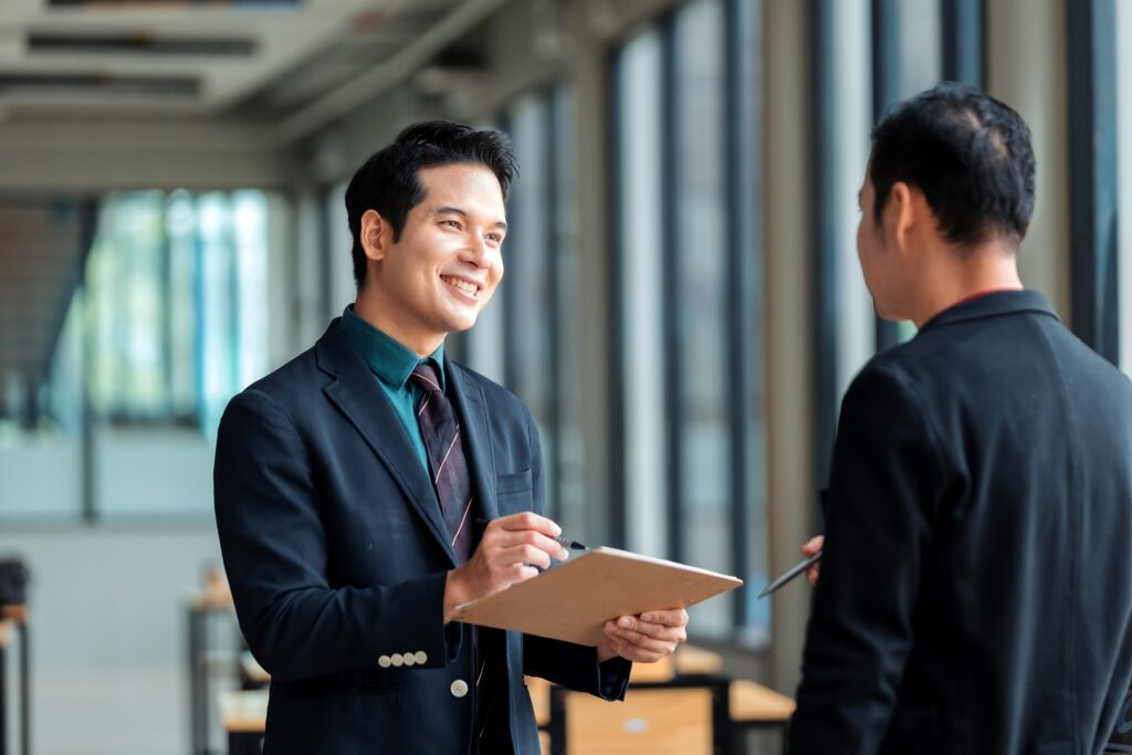 two Asian businessmen having a professional discussion