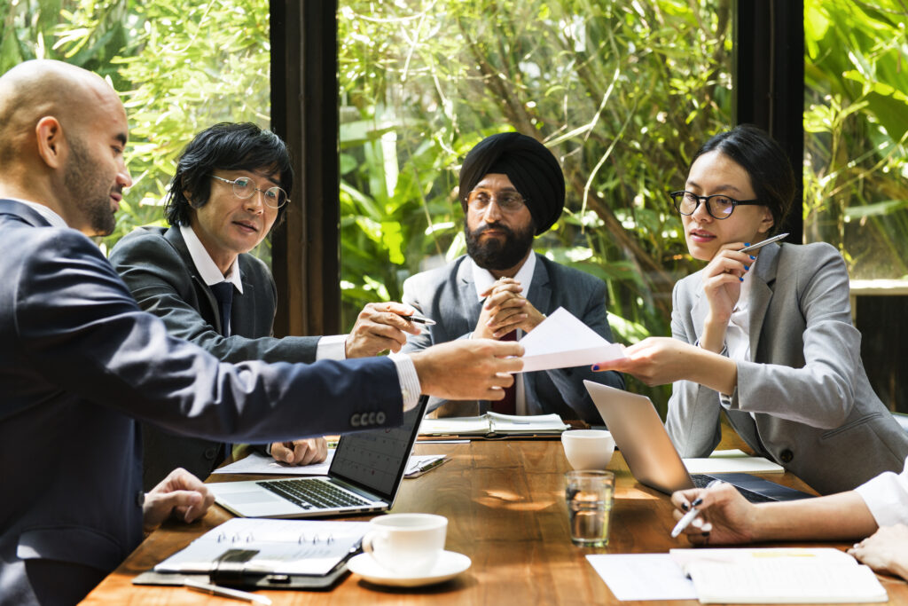 businessmen of different nationalities having a discussion