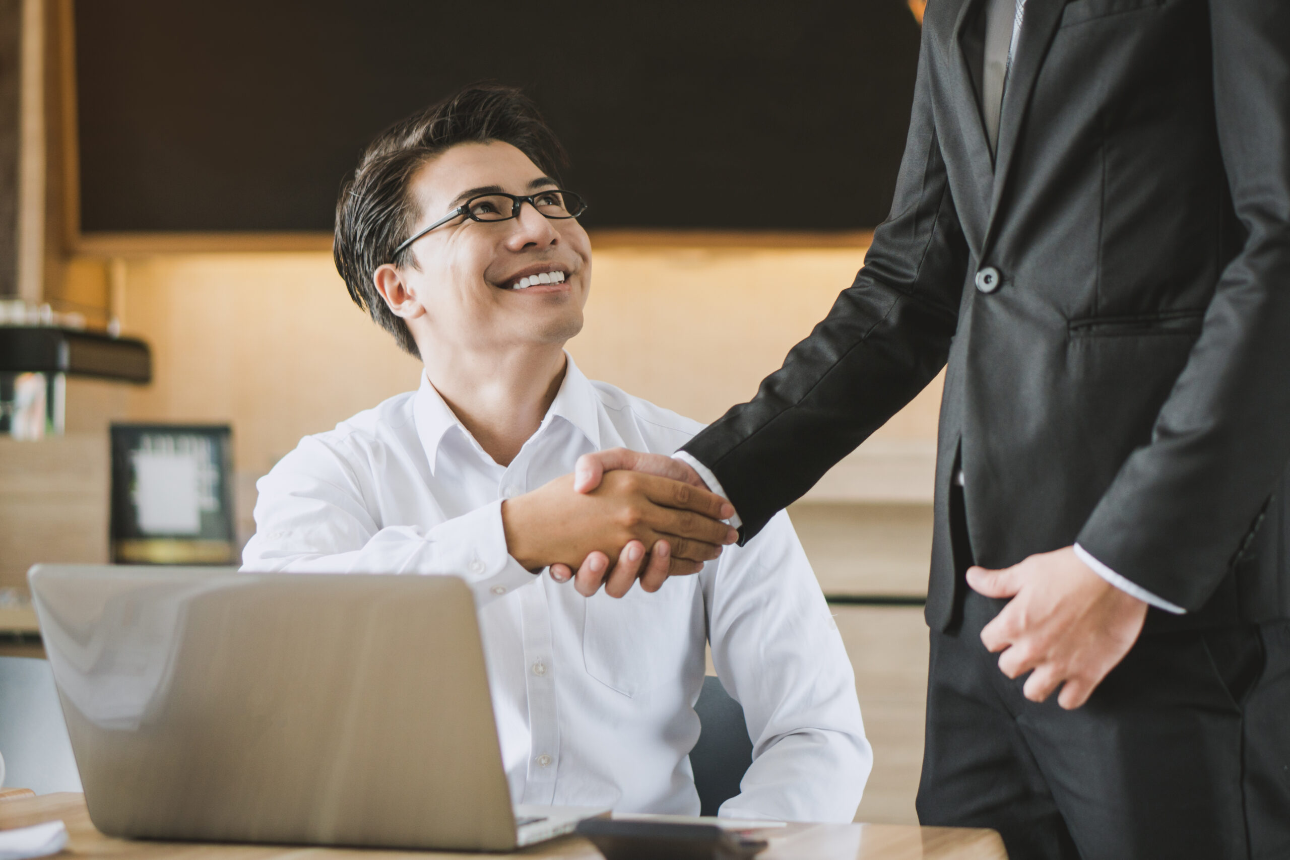 two businessmen shaking hands