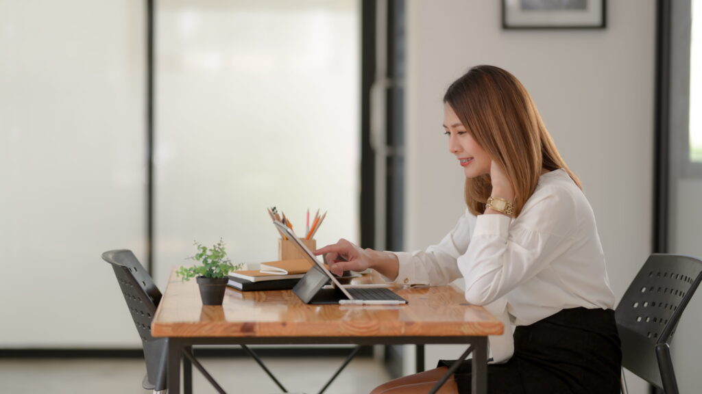a leadership student checking her tablet