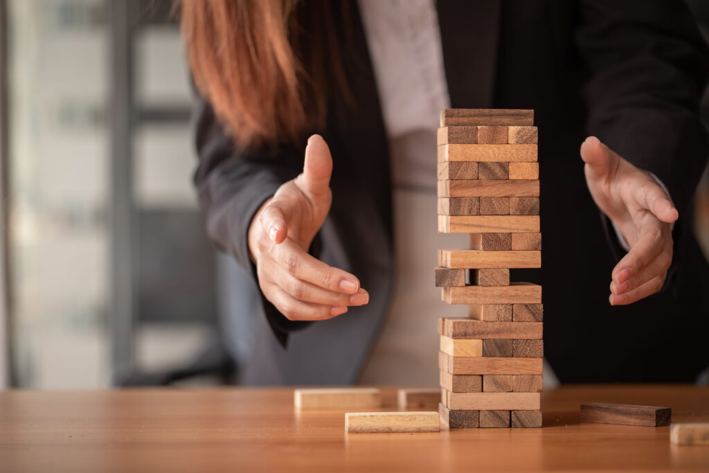 a business woman with different mini blocks stacked together