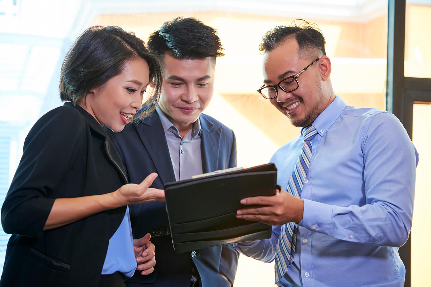 International MBA students reviewing a business proposal together, highlighting collaboration and professional networking in a global learning environment.