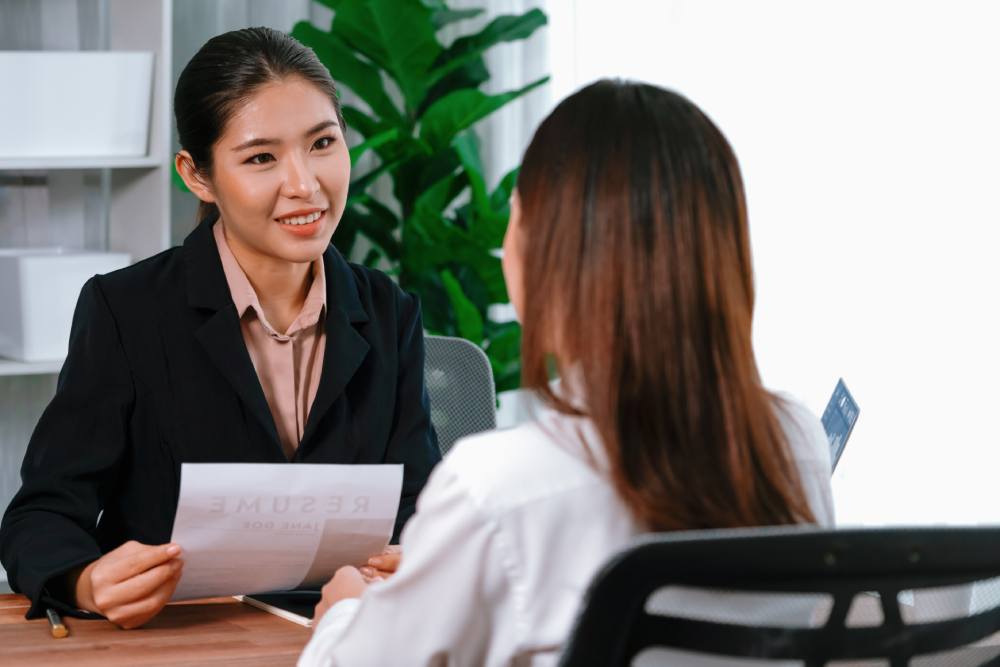 A recruiter interviewing an applicant.